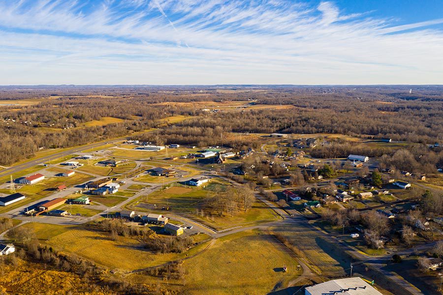 Danville, KY - Aerial View of Kuttawa, Kentucky Displaying Flat Plains, Homes and Trees on a Sunny Day
