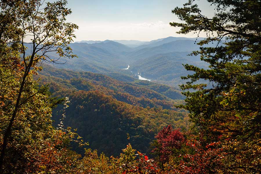 Irvine, KY - Aerial View of Cumberland Gap National Historical Park Displaying Green and Red Trees and Mountains